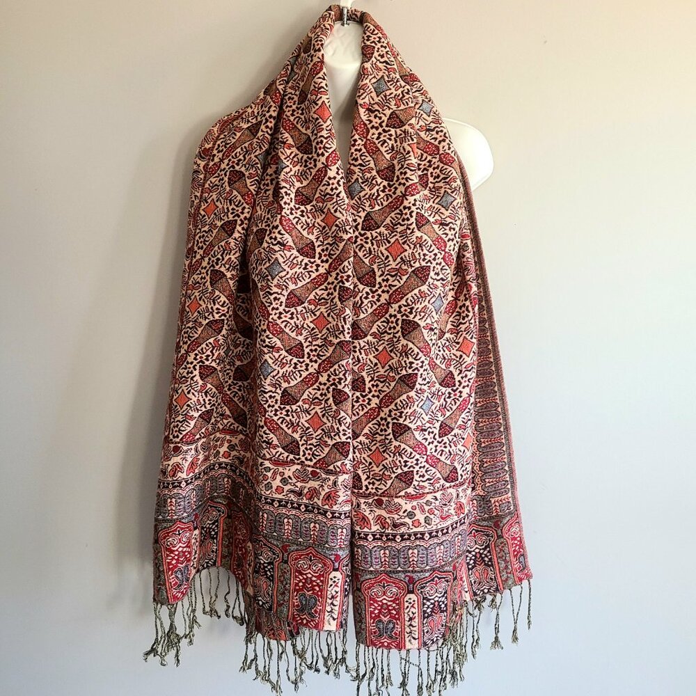large red and brown scarf/shawl with fringes.